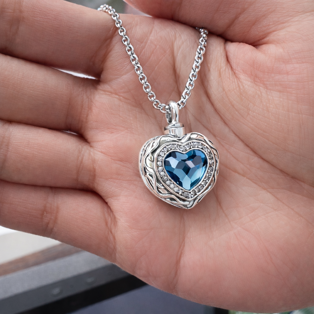 Real Blue Heart cremation necklace held in a hand