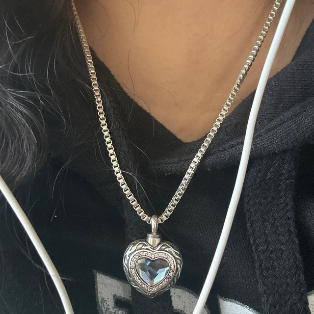 Customer photo of the Blue Heart cremation necklace worn on a black shirt