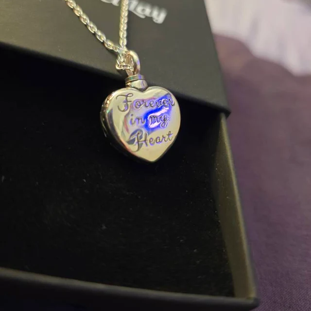 Customer photo of the back engraving on the Blue Heart cremation necklace
